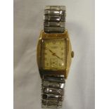 A gentleman's 9ct gold wrist watch by JW Benson of London with rectangular dial and expanding strap