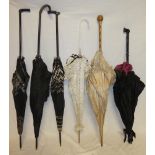 Six various Edwardian and later parasols/umbrellas including silk examples,