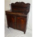 A mid-19th Century mahogany chiffonier with a single drawer in the frieze above a cupboard enclosed