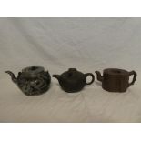 A Chinese terracotta & pewter mounted circular teapot with dragon decoration and two other various