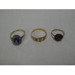 A Victorian gold dress ring set a diamond flanked by two rubies,