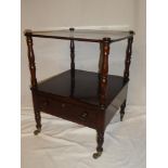 A 19th Century rosewood square two tier whatnot with a single drawer in the frieze on turned