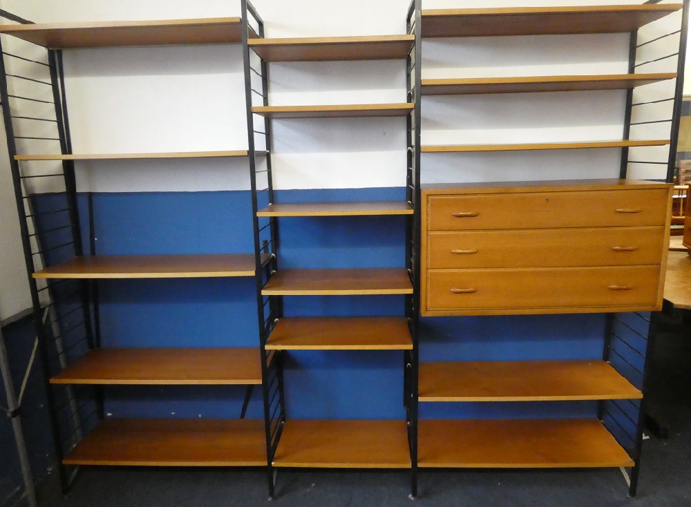 A 1960's Ladderax shelving system of three bays with three drawer chest and open shelves