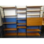 A 1960's Ladderax shelving system of three bays with three drawer chest and open shelves