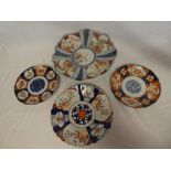 A 19th Century Japanese Imari pottery circular charger with painted floral decorated panels and