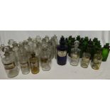A selection of various old Chemist bottles including many clear glass examples with names,