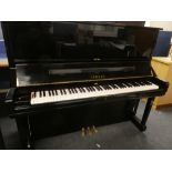 A high quality upright over-strung piano by Yamaha No.