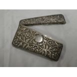 A 19th Century Continental silver rectangular curved visiting card case with raised floral