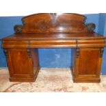A Victorian mahogany pedestal sideboard with three drawers in the frieze,