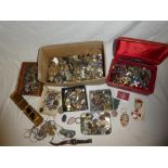 Various small boxes of costume jewellery, watches, miniature badges,