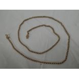 A 9ct gold long guard rope twist necklace