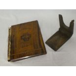 A Jerusalem inlaid olive wood book cover with carved centre and an old wooden folding boot pull (2)