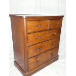 A Victorian mahogany chest of two short and three long drawers with turned handles on plinth base