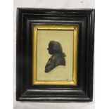 An early 19th Century miniature silhouette depicting a bust portrait of a gentleman "W Pinson" 4"