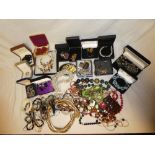 A box containing a selection of mixed costume jewellery