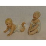 Two various Continental china Piano Baby figures