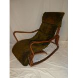 A 1960's ply/laminate rocking chair with original nylon upholstery (af)