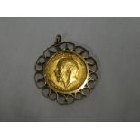 A 1913 gold sovereign in 9ct gold pendant mount