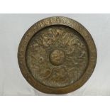 A large 19th Century bronze circular plaque decorated all over with numerous classical dancing
