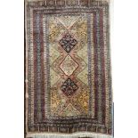 A good quality Eastern wool Bokhara rug with geometric decoration on red and cream ground,