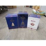 Three Bell's Whisky decanters,