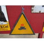 A triangular enamel warning sign