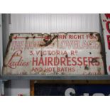 An enamel sign for The House of Lovelace Ladies Hairdressers and Hot Baths,