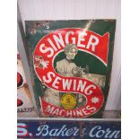 An enamel pictorial sign Singer Sewing Machines,