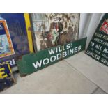 A green enamel Wills Woodbines sign,