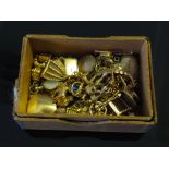 A box of 18ct and 9ct gold charms and miscellaneous lockets (approx 60) (9ct 65g, 18ct 1.