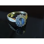 An 18ct gold sapphire and diamond ring, size O, 4.