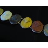 A Victorian seven panel lava cameo bracelet each panel depicting different profile of different