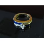 A dress ring with alternate diamond and blue enamel bands centre diamond in high mount, size Q, 7.
