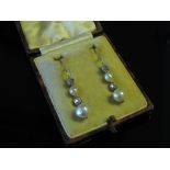 A pair of Edwardian diamond and graduated natural pearl drop earrings, 2.