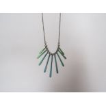 A 1980's white metal graduated paddle necklace with blue and green titanium coated paddles