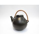 Arabia 1950's Ulla Procope designed matt back teapot with cane handle,