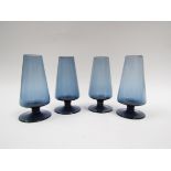 A set of four Caithness glass drinking glasses in midnight blue