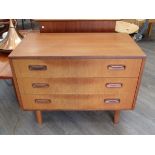 A G-Plan teak chest of three drawers, raised on tapering legs 81cm x 46cm x 61.