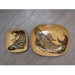 DAVID EELES (1933-2015): Two Shepherds Well Pottery slipware dishes with fish detail,