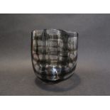 A studio glass vase, clear with irregular smokey brown grid decoration,