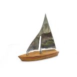 A sculptural yacht with aluminium sail and fruitwood hull, unmarked 43.