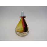 An art glass perfume bottle in cased amber and cranberry,