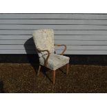 A Danish 1940's beech framed armchair, floral upholstery,
