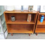 A Danish teak open bookcase raised on tapering legs, 88cm x 29cm x 91.