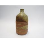 PETER LANE (b.1932): An early stoneware bottle vase, ash and biscuit glaze.