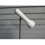 A white standard lamp with single adjustable spot