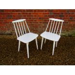 Two white painted chairs made in Denmark by FDB Mobelfabrik designed by Folke Palsson model J77