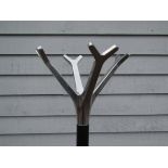 A modern "Caimi Brevertti" coat stand in aluminium and painted black metal.