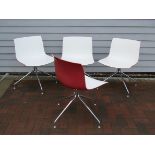A set of four white and red Catifa dining chairs designed by Lievore Altherr Molina