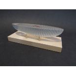 A Kosta Boda glass sculpture of a boat by Bertil Vallien, set on a wooden plinth,